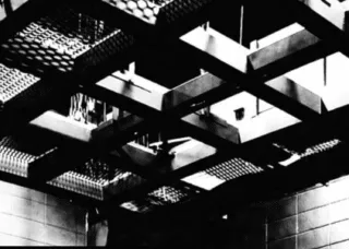 people on stage, chairs near 